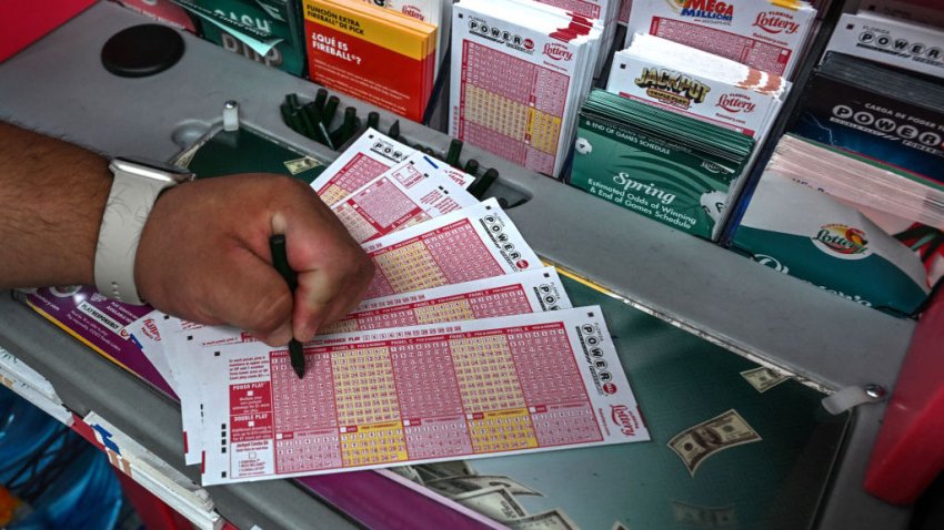 A woman fills in Powerball lottery tickets inside a store in Homestead, Florida on July 19, 2023. The Powerball jackpot has reached 1 billion USD for the July 19, 2023, drawing, which has only happened two times before in the history of the game. (Photo by GIORGIO VIERA / AFP) (Photo by GIORGIO VIERA/AFP via Getty Images)